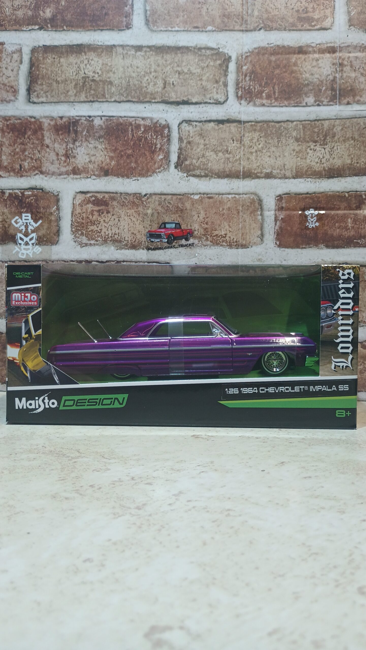 Brand new 1/26 scale diecast car model of 1964 Chevrolet Impala SS Lowrider Purpul with Gold Graphics "Lowriders" "Maisto Design" Series die cast model car by Maisto